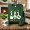 Forest green sweatshirt mockup showing three cute geese with trendy coquette bows and clover necklaces.