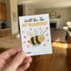 DIY Bee Valentine card idea with a honey stick attached using washi tape saying Sweet as Honey.