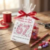 DIY gift idea using printable 67 slang valentine card as a gift tag tied with red ribbon to a bag of heart candies.