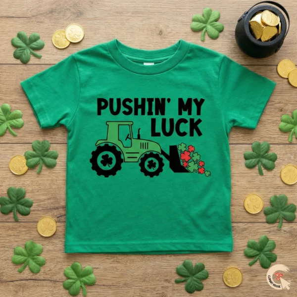 Pushin' My Luck St. Patrick’s Day Tractor SVG on green kids' t-shirt with shamrocks and gold coins.