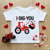 I Dig You Valentine Tractor SVG on white toddler t-shirt with toy tractor and heart candies.