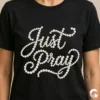 Just Pray Pearls Christian sublimation design on black t-shirt worn by model, pearl bead lettering religious apparel, faith-based fashion mockup
