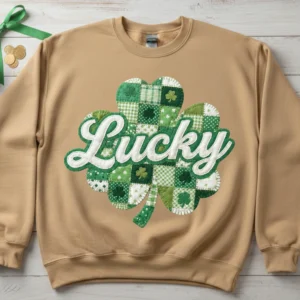 Lucky Shamrock Patchwork PNG design on a sand-colored oversized sweatshirt mockup for St. Patrick's Day.