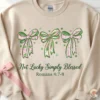 Not Lucky Simply Blessed sweatshirt with pink and green coquette bows and Romans 4:7-8 scripture.