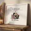 Framed friendship wall art print displayed on a rustic wooden console table next to a glowing candle.