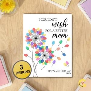 A flat lay photo of the Dandelion fingerprint card on a wood table surrounded by ink pads and a gold badge that reads 3 DESIGNS.